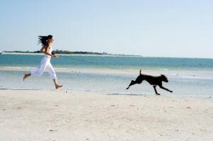 Running on the beach with dog - healthy living ideas.jpg